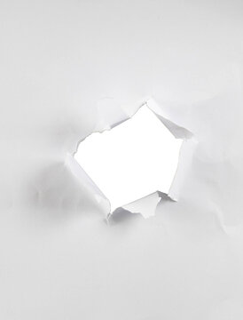 &nbsp;A torn paper hole on transparent background