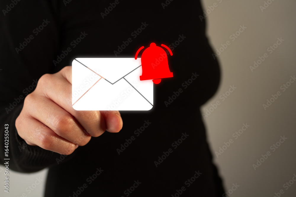 Poster woman pointing forward at a floating icon of an envelope with a notification bell