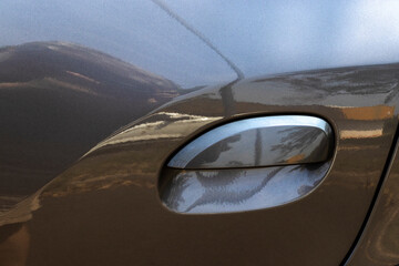 Modern silver car door handle.Car door handle is an external part of the car in Brazil.