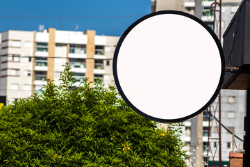 Blank circular shop signboard mockup for design. Street hanging sign board for logo presentation. Cafe restaurant or bar badge black white round, in Brazil