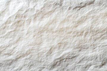 Close-up view of textured, creased, off-white fabric