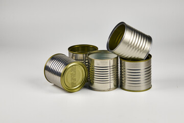 Metal and glass containers stacked for recycling because they are no longer used on a daily basis,...