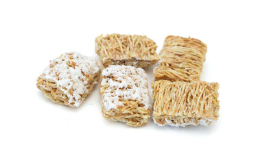 Breakfast setting with frosted wheat cereal on white background 