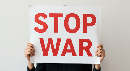 Activist Holding a 'Stop War' Protest Sign