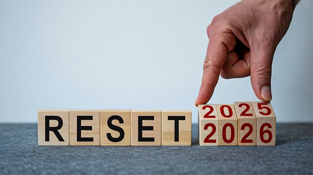Wooden blocks showing reset concept with years 2025 and 2026