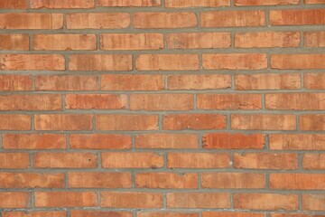 Texture of red brick wall as background, closeup