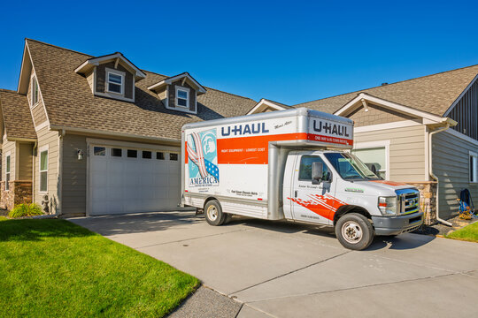 General view of a 15' U-Haul rental moving truck parked in the driveway of a suburban home. U-Haul is the leading do it yourself moving company in the United States, July 9 2025.