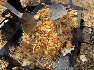 Yakisoba cooked on a large iron plate