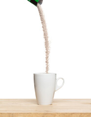 3 in 1 instant coffee powder mixed fly fall in cup, 3 in 1 instant coffee for fast easy float in air. 3 in 1 instant coffee throw in mid air. White background isolated high speed freeze motion