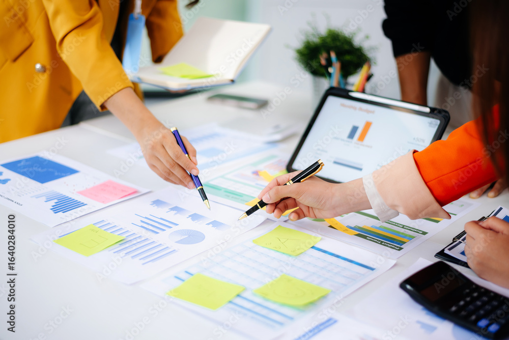 Poster business documents on office table with smart phone and calculator digital tablet and graph business