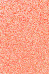 Fototapeta premium Textured abstract texture of a cement wall in soft pink color.