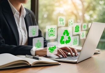 Sustainable business woman working on laptop with green energy icons for environmental solutions
