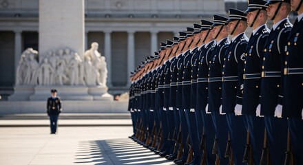 A line of soldiers in uniform standing at attention in front of a monument on a sunny day outdoors