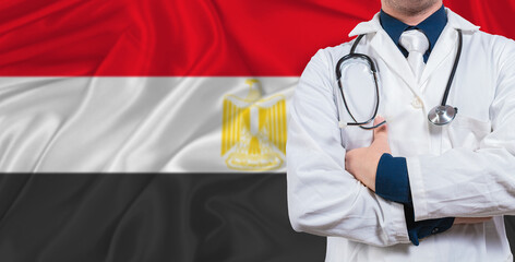 Male doctor with stethoscope on Egypt flag. Doctor holding stethoscope on Egypt flag
