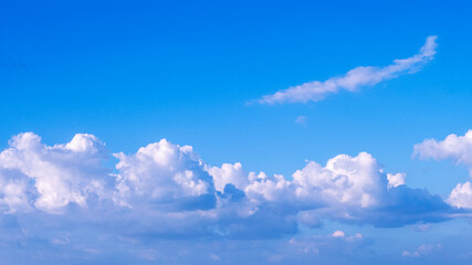Blue sky fluffy white clouds on summer season bright clear skyline with beautiful cloudscape. Panorama blue sky clouds pattern on daylight with copy space. Cumulus cloudscape air climate sunny day