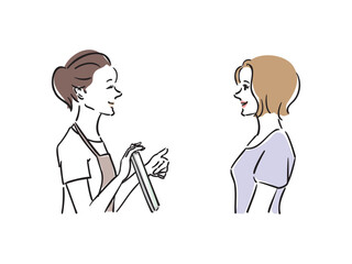 美容サロンでカウンセラーと相談する女性
