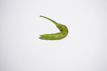 fresh chilies on white paper