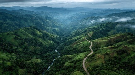 Lush valley, winding road, mountain range