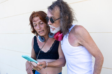 Transgender woman showing social media content to her friend using a smartphone