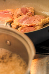 Chicken Thighs Searing in Frying Pan