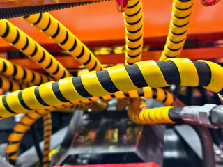 Industrial machinery features colorful tubing for enhanced organization and safety in a...