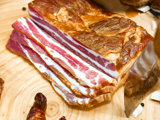 Deliciously smoked bacon strips displayed on a wooden cutting board with rustic charm