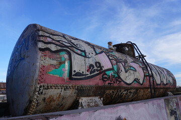 old rusty abandoned and graffitied  water tank
