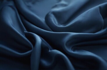 Fototapeta premium Sleek dark blue fabric with silky texture and elegant sheen, creating a sense of movement in a sophisticated setting.