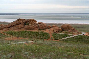 Fancy stones on the slopes of Bolshoe Bogdo Mountain and the salt lake Baskunchak in the distance...