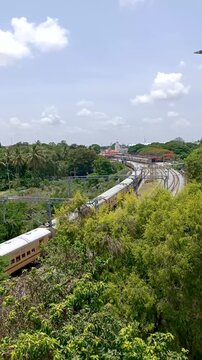 Mysuru, Karnataka, India-July 23 2025; A passenger train moving towards the heritage Mysore railway station, a popular travel destinations in Karnataka, India.
