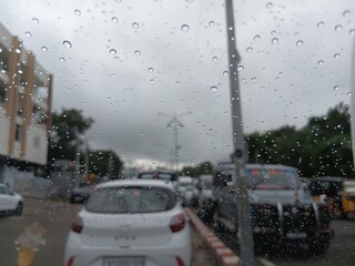 Background of water drops on a window glass in a rainy day