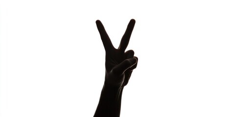 Obraz premium A silhouette of a person making a peace sign with their hand against a white background.
