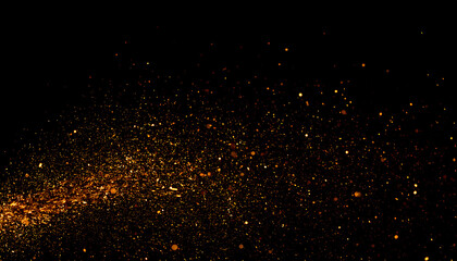 Fiery golden embers and sparks floating in a dynamic explosion against a solid black background
