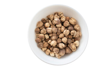 A bowl of cardamom (kapulaga) seeds isolated on a white background