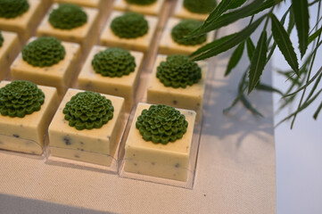 gourmet white chocolate party sweets, elegant floral dessert decoration, square sweet treats for...
