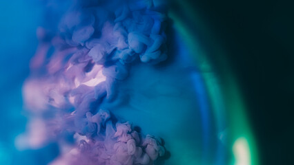 Cloud blend. Ink background. Blur purple blue green color splash shimmer liquid rainbow texture...