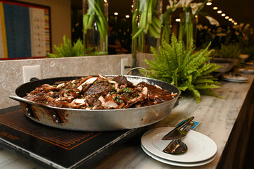 mushroom and meat dish, buffet food catering, large pan with gourmet meal, delicious beef and...
