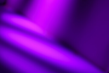 Elegant abstract background with smooth, flowing diagonal waves of purple light. Luxurious texture similar to satin or silk fabric.