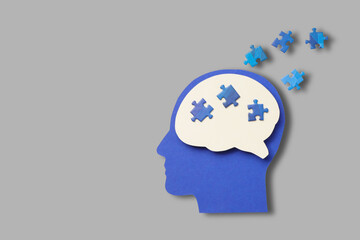Brain with puzzle pieces symbolizing thoughts and solutions