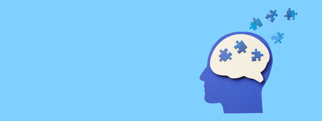 Brain silhouette with puzzle pieces represents creativity