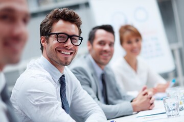 Naklejka premium Enthusiastic young professionals in a corporate meeting