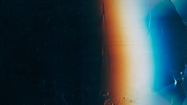 Scratched black glass. Damaged texture. Vintage dust cracked dark screen. Colorful light blur glow abstract night background free space. - Powered by Adobe