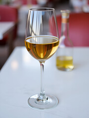 A glass of wine is sitting on a table