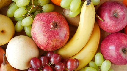 Colorful arrangement of various fruits creates a vibrant and appetizing display.