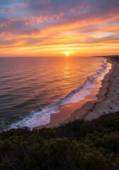 Sunset Over Ocean Beach with Vibrant Sky and Rolling Waves