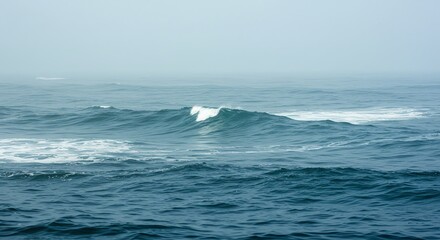 Calm Blue Ocean Waves Rolling Under Overcast Sky