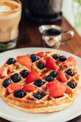 Berry-Topped Waffle with Latte and Maple Syrup