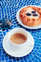 Cup of Espresso and Blackberry Pastry at Outdoor Café Table