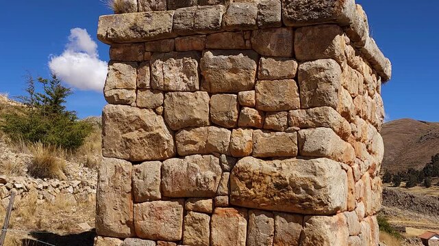 A stunning panoramic view of the ancient stone funerary monuments of Chullpas de Molloco near Acora, Peru, highlighting their historical significance in the Andean landscape.