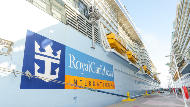 CocoCay, Bahamas - February 13, 2025: Royal Caribbean cruise ship docked at port showcasing vibrant branding and modern architecture with clear blue sky